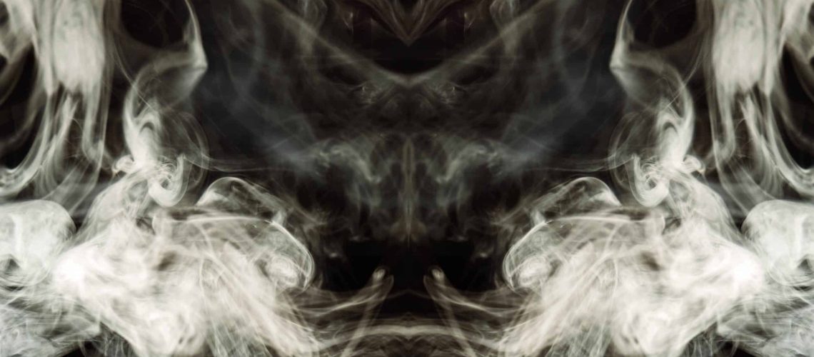 brown-wavy-smoke-black-background-min