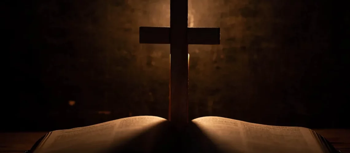 cross-with-bible-candle-old-oak-wooden-table-min