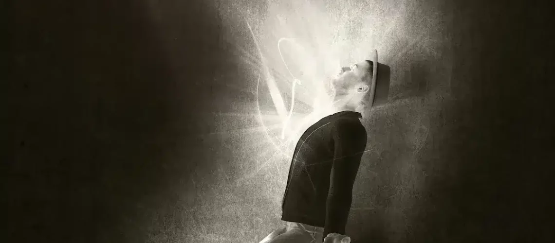 man-his-knees-with-ray-light